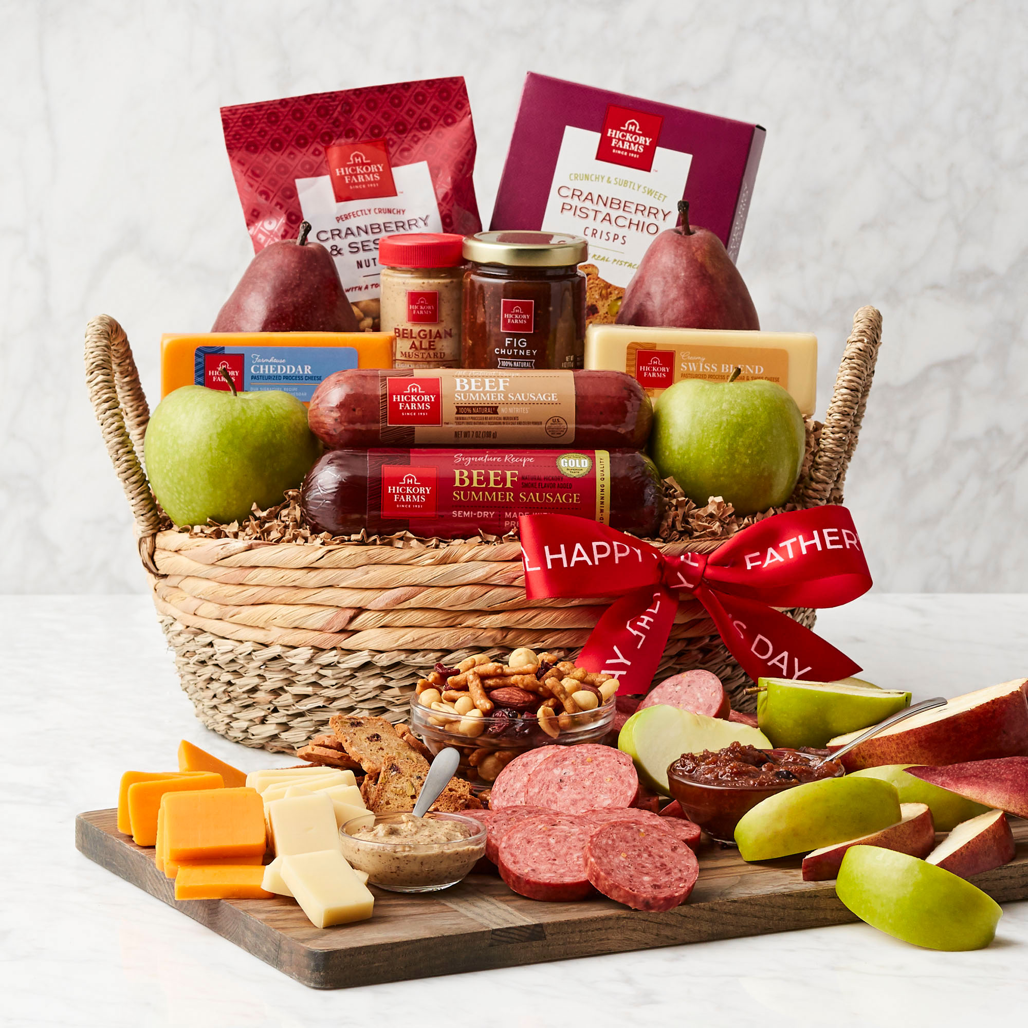 Father&rsquo;s Day Premium Fruit & Snack Gift Basket - Brown basket with fruit, meats, cheeses, and a red ribbon.